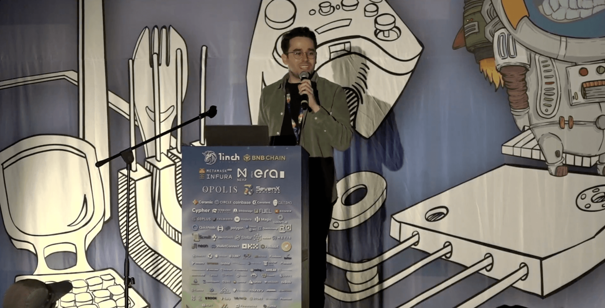 Rick speaking on stage in Denver about hackathons and developer engagement
